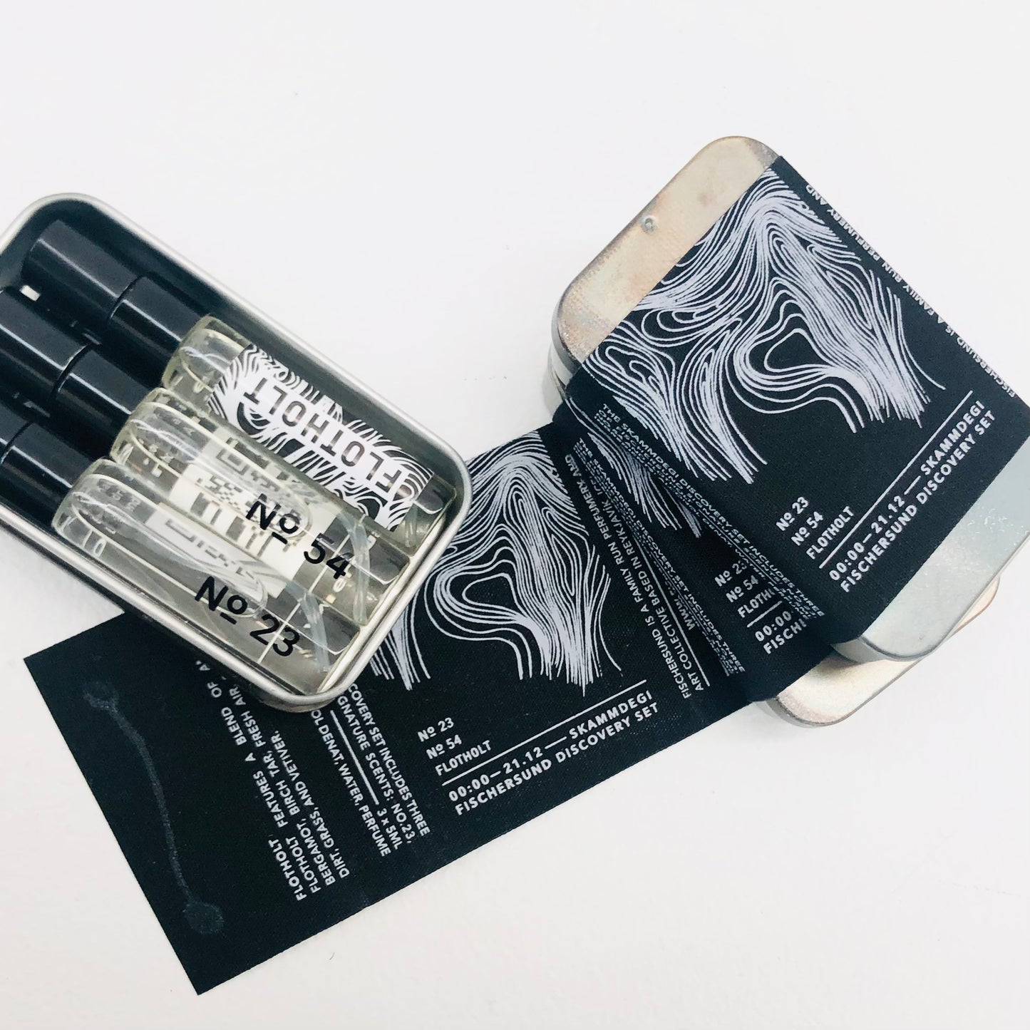 The set is housed in a hand-treated tin box made by our father Birgir and features fragrances - No. 23, No.54 and Flotholt. A perfect way to discover your new fragrance favorite.