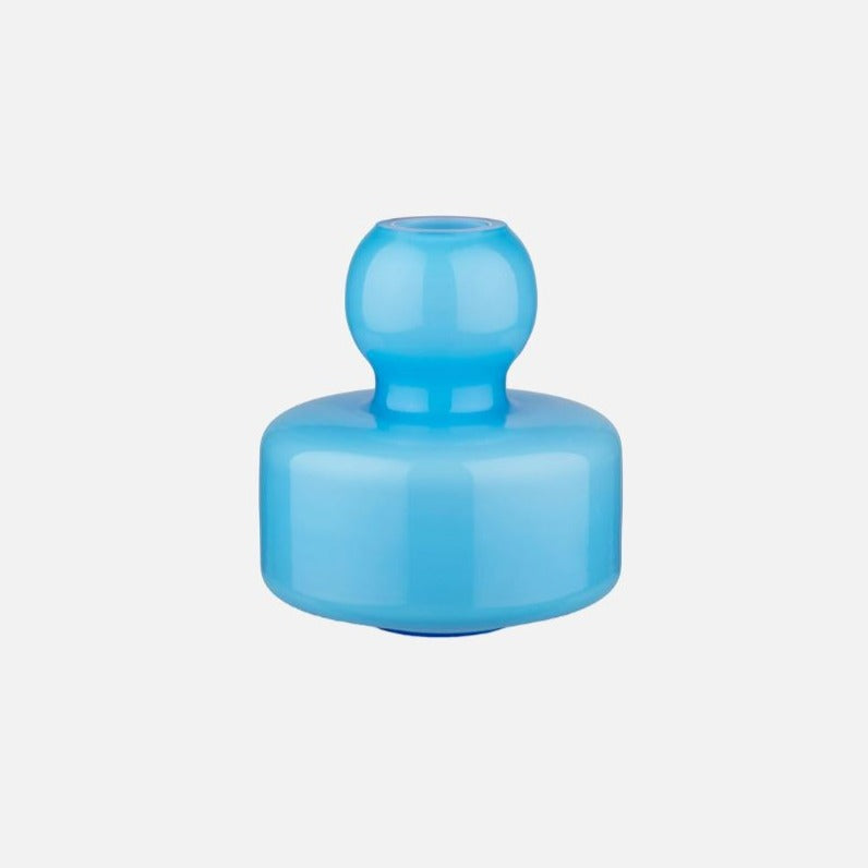 Marimekko flower Vase blue The small Flower vase is designed by Carina Seth Andersson, and it is made of mouth-blown glass. We recommend washing the vase by hand. This product is packed in the Marimekko Logo pattern box.
