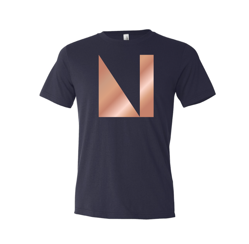 Show your pride in the National Nordic Museum by sporting this cute tee! Our newest poly cotton t-shirt comes in navy blue with a shimmery rose gold foil logo.